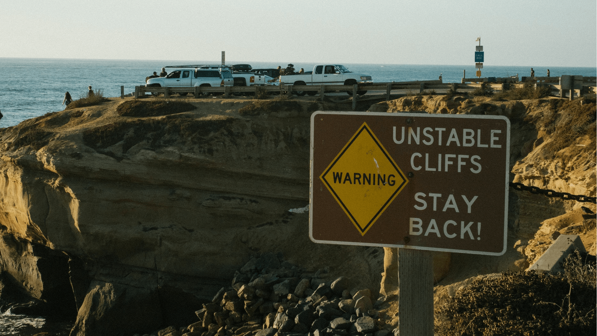 Warning sign for unstable coastal cliffs