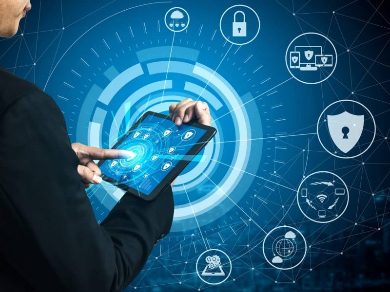 Person using tablet with cybersecurity interface