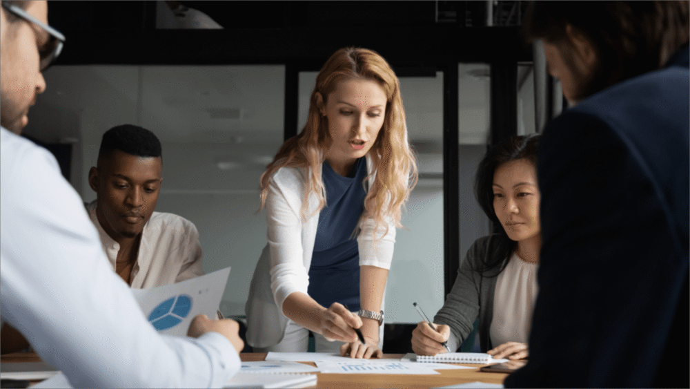 Business team meeting with woman presenting