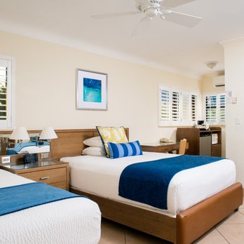 Hotel room with twin beds and blue accents