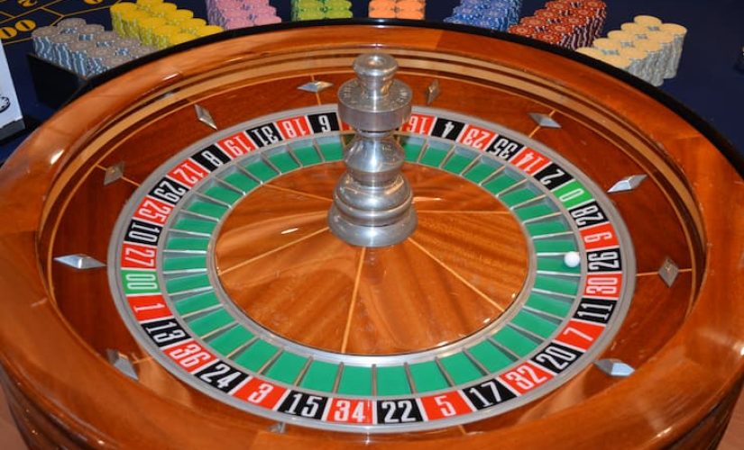 Wooden roulette wheel with colorful betting numbers