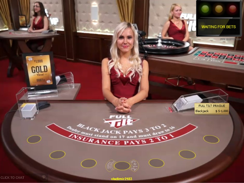 Smiling dealer at live blackjack table