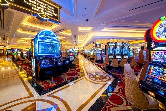 Luxurious casino floor with rows of slot machines