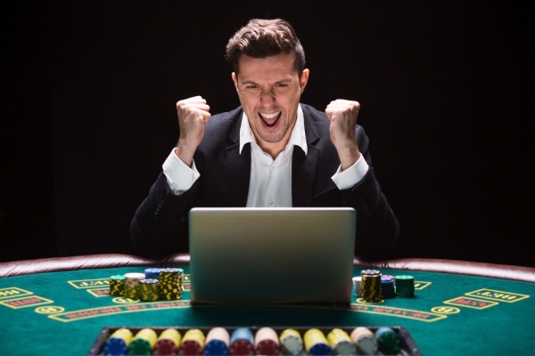 Excited gambler celebrating win at online casino